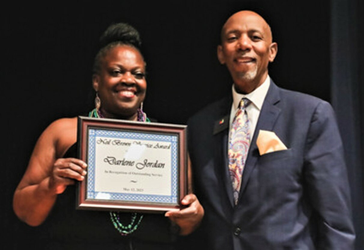 Darlene Jordan, the head custodian at Howard Hall Elementary School, was award this year's Neil Brown Service Award by Cumberland County Schools. With her is Superintendent Marvin Connelly Jr.