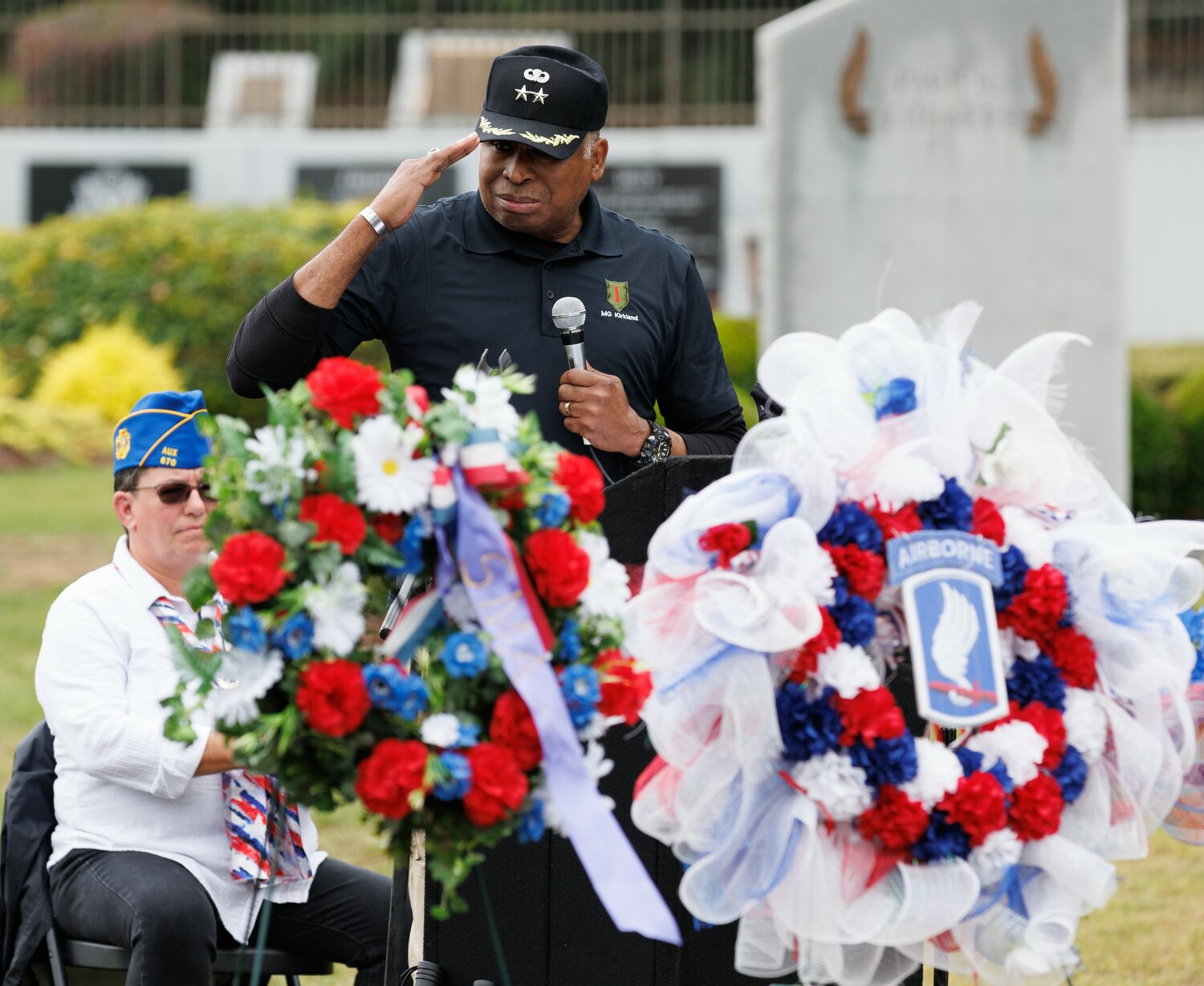 Retired Maj. Gen. William Kirkland salutes during the Memorial Day ceremony at Freedom Memorial Park.