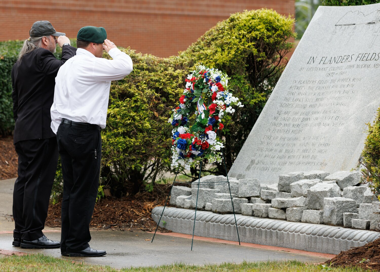 A wreath is lain at a monument during the Memorial Day ceremony at Freedom Memorial Park.