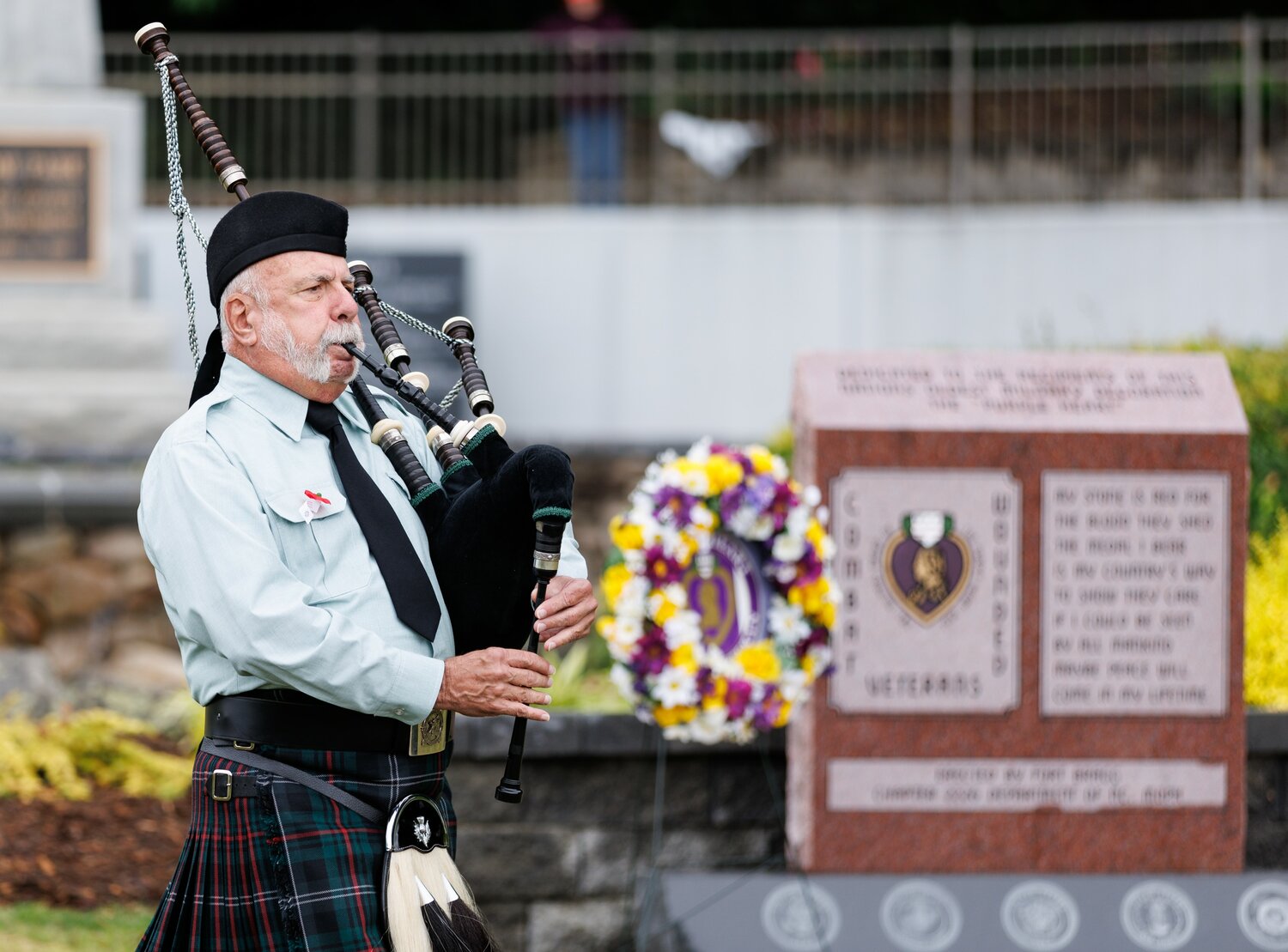 A bagpipe musician plays during the Memorial Day ceremony at Freedom Memorial Park.