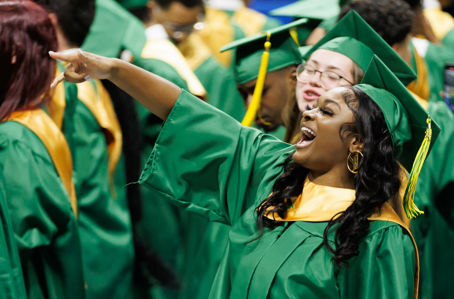 A Pine Forest High School graduate celebrates at commencement Monday in the Crown Coliseum.