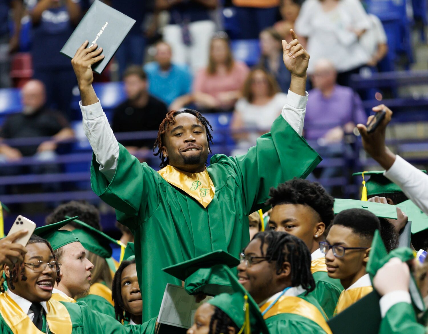 Pine Forest High School graduates celebrate at commencement Monday in the Crown Coliseum.