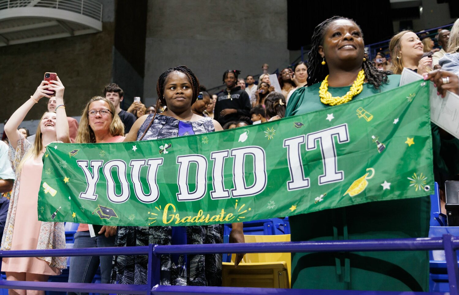 Spectators show their pride at the Pine Forest High School commencement Monday in the Crown Coliseum.