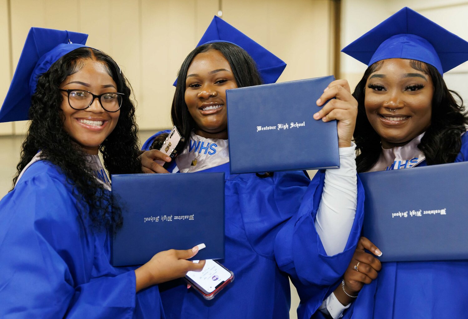 Graduates show off their diplomas at the Westover High School 2023 commencement Tuesday at the Crown Coliseum.