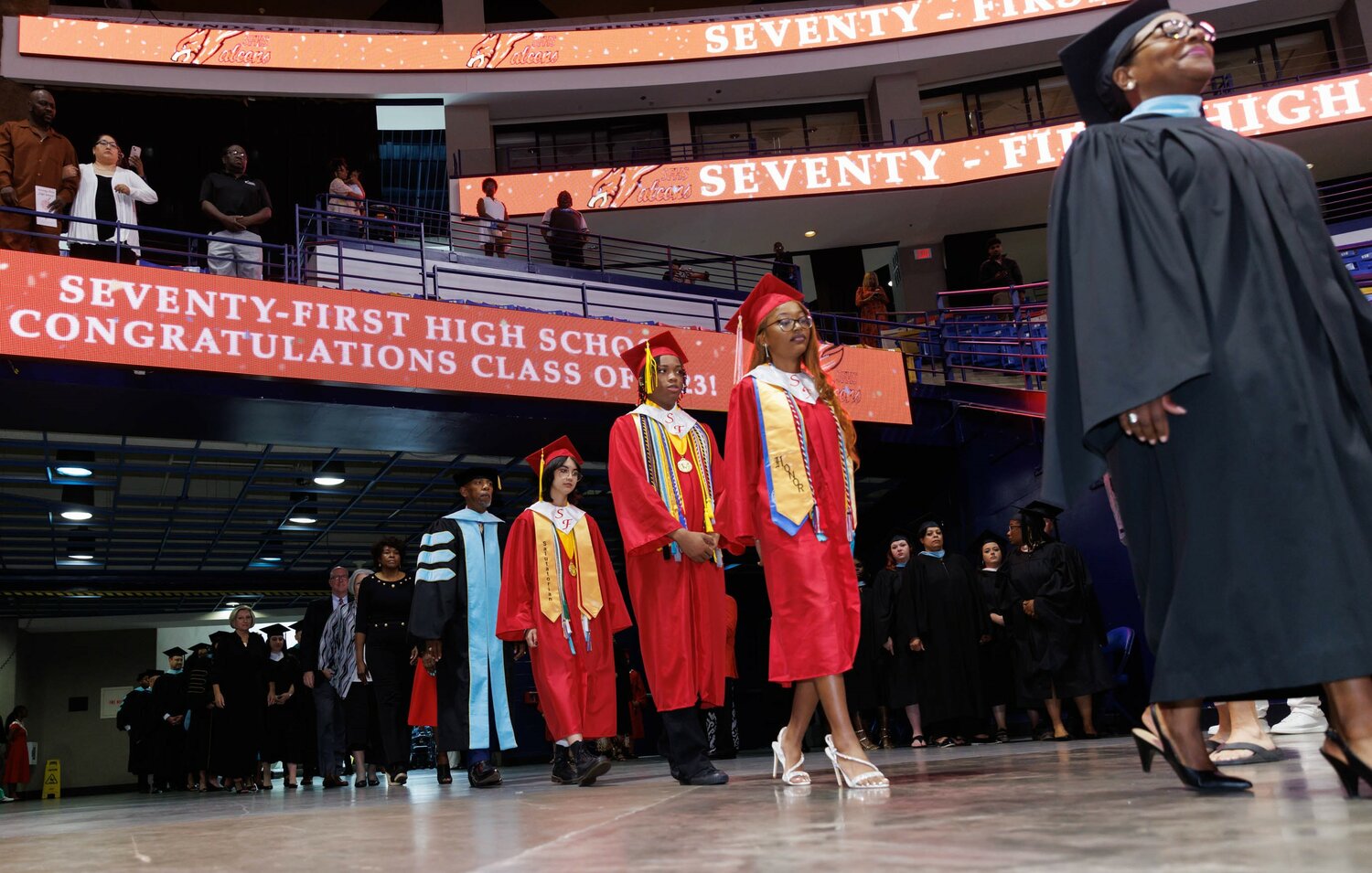 Graduates file in for the 2023 commencement for Seventy-First High School on Tuesday at the Crown Coliseum.