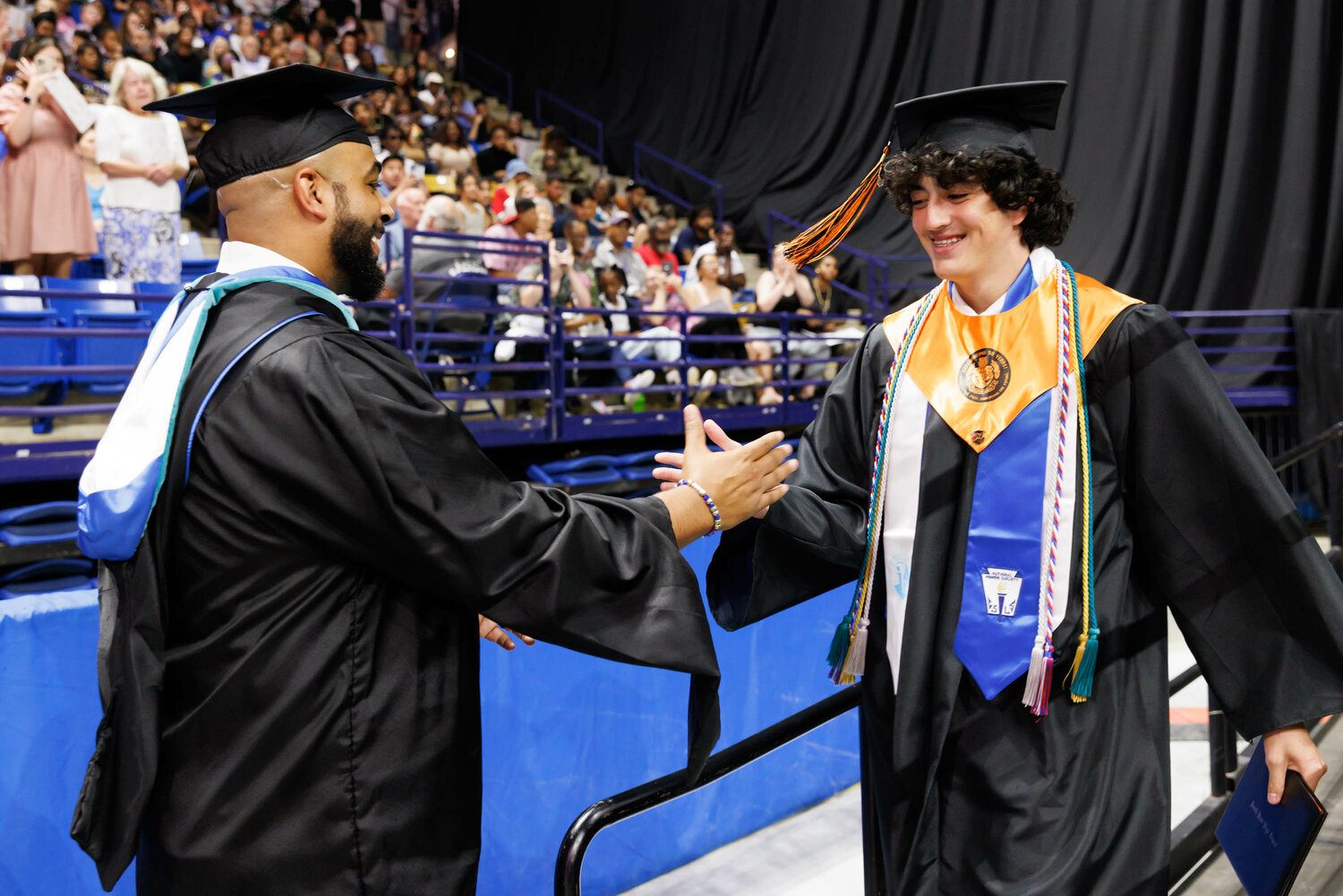 A graduate receives congratulations and his diploma during the South View High School 2023 commencement Tuesday at the Crown Coliseum.