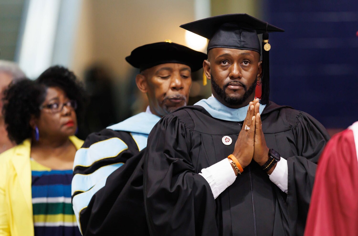 Educators enter the Crown Coliseum on Wednesday for the Douglas Byrd High School 2023 commencement.