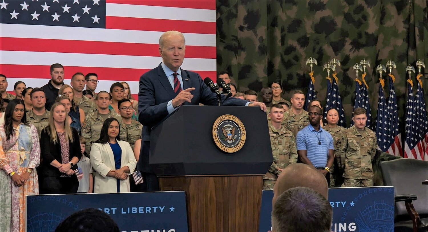 President Joe Biden speaks before a large crowd at Fort Liberty’s Hercules Fitness Center on Friday, touting his executive order that aims to support military families.