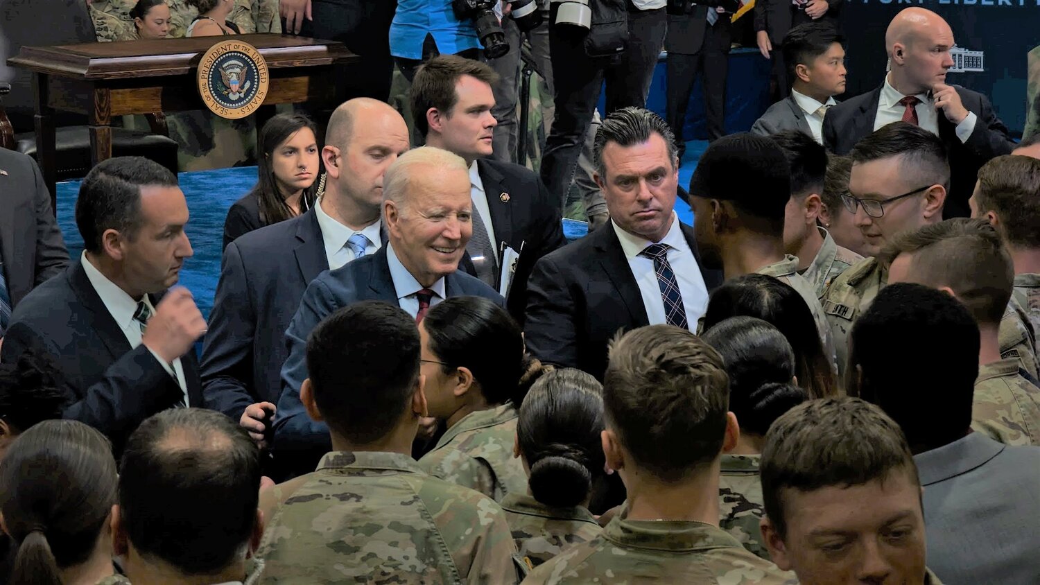 President Joe Biden, following his speech about an executive order on military family support, mingles with military personnel on Friday on Fort Liberty.