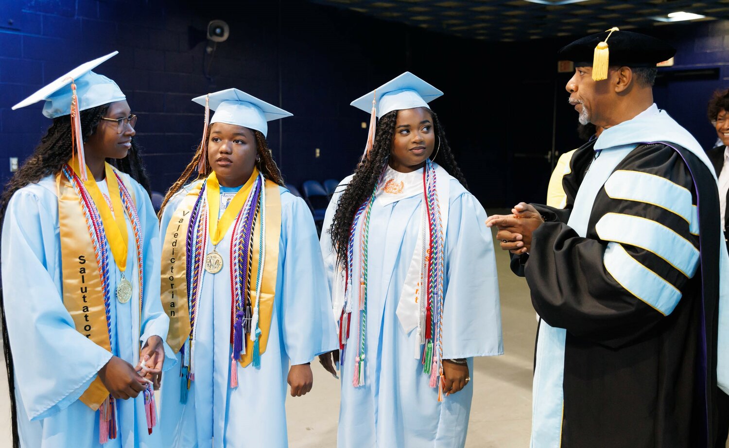Superintendent Marvin Connelly Jr. talks with graduates at the 2023 commencement for Reid Ross Classical High School at the Crown Coliseum on Wednesday.