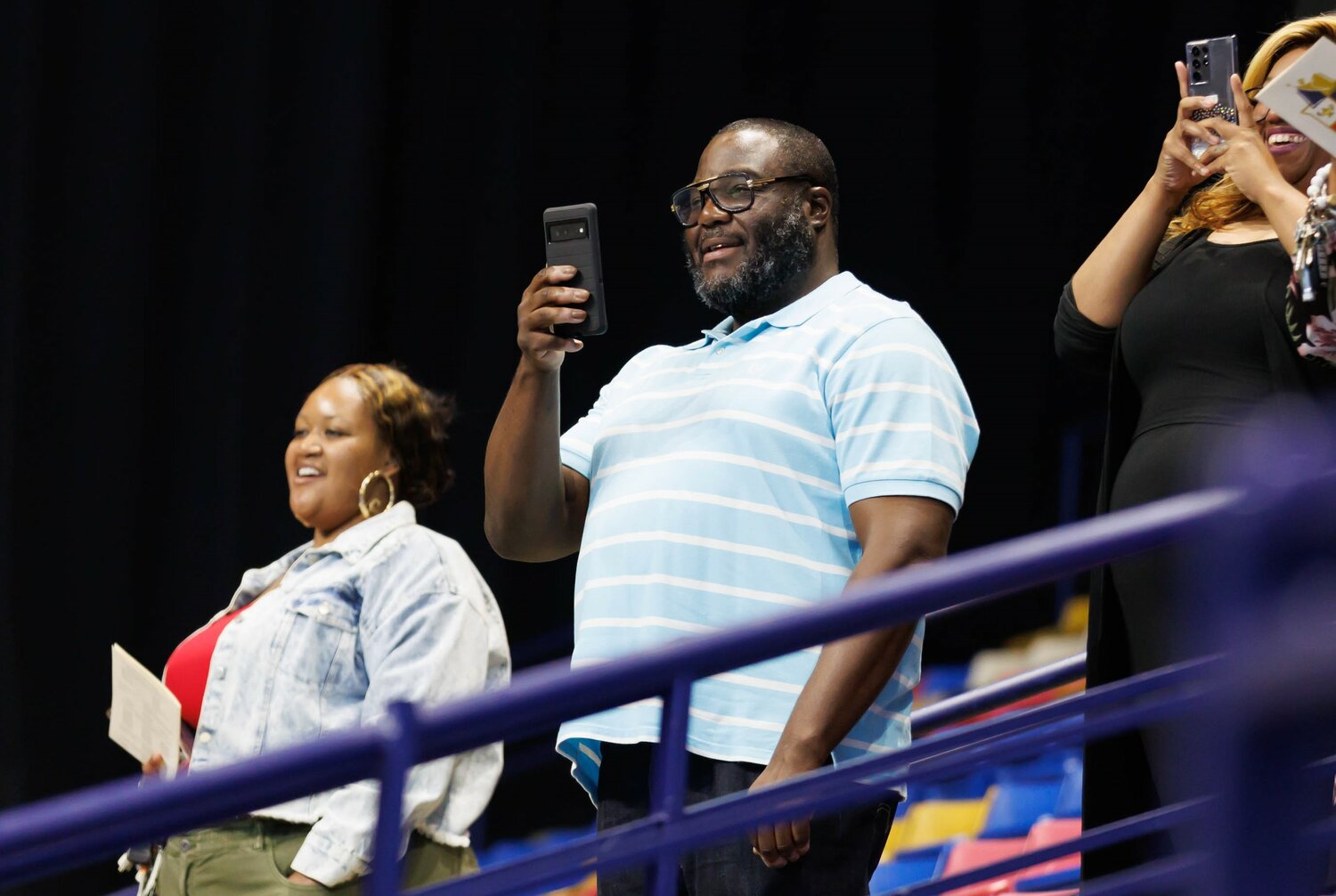 Spectators capture video of the Cumberland Academy Virtual School 2023 commencement Wednesday at the Crown Coliseum.