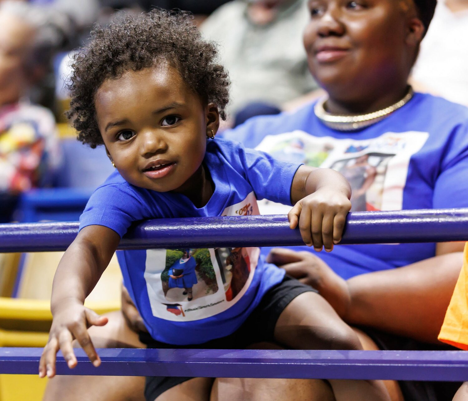 A young spectator is eager to congratulate the graduates at Cumberland Academy Virtual School's 2023 commencement Wednesday at the Crown Coliseum.