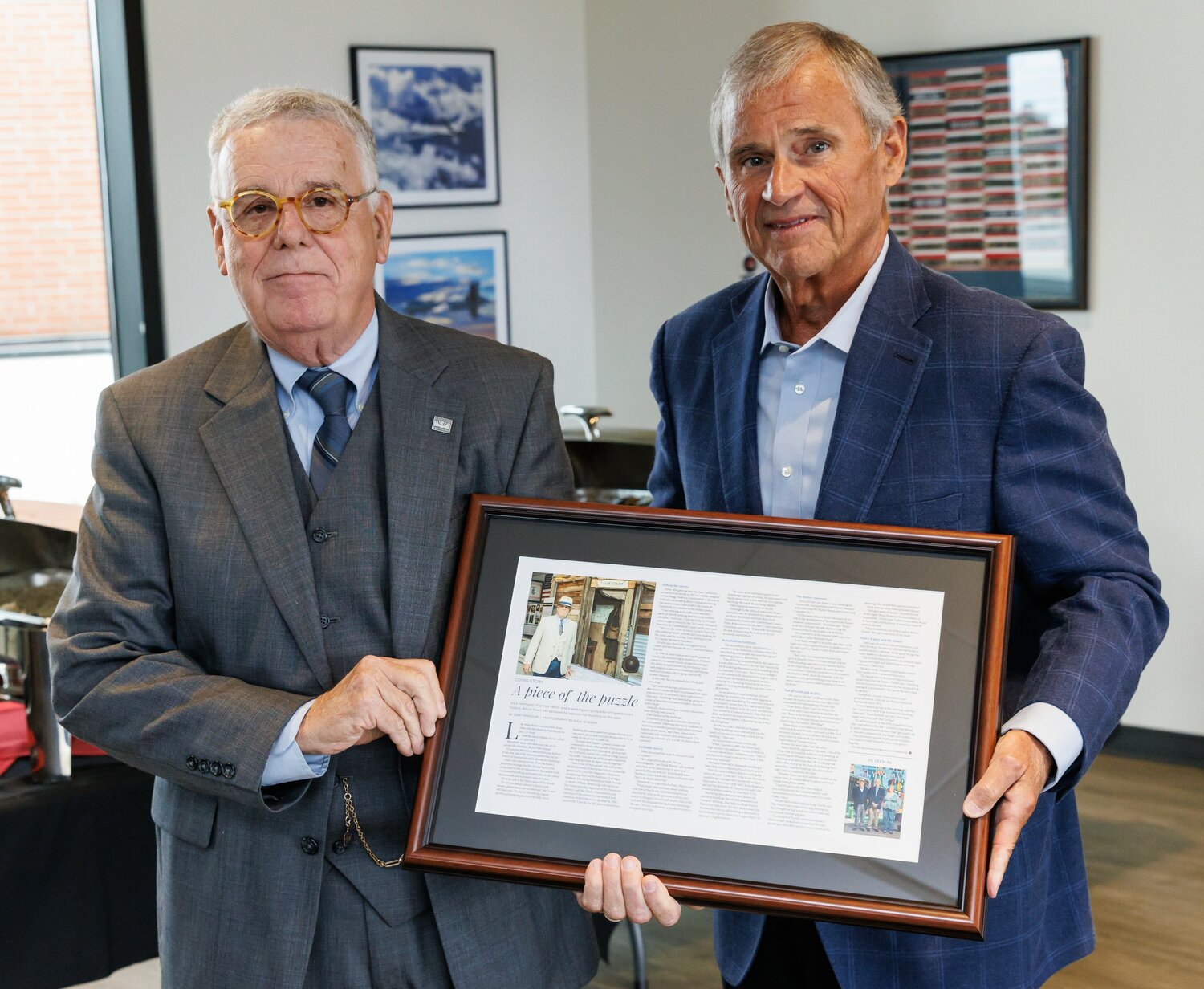 CityView publisher Tony Chavonne, right, presents Bruce Daws with the Downtown Visionaries award on Thursday at Segra Stadium.