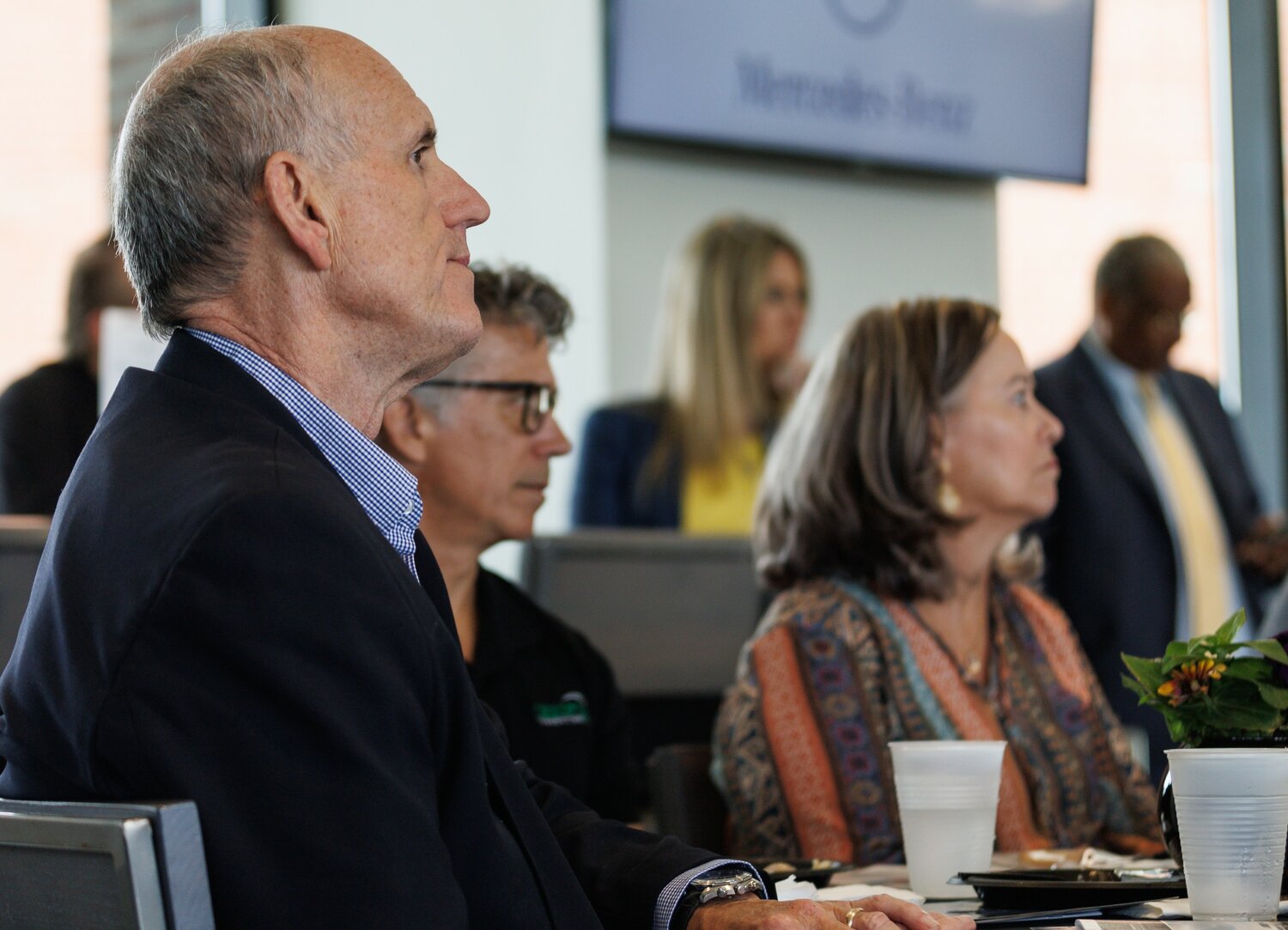 Mac Healy listens during the Downtown Visionaries awards luncheon Thursday at Segra Stadium.