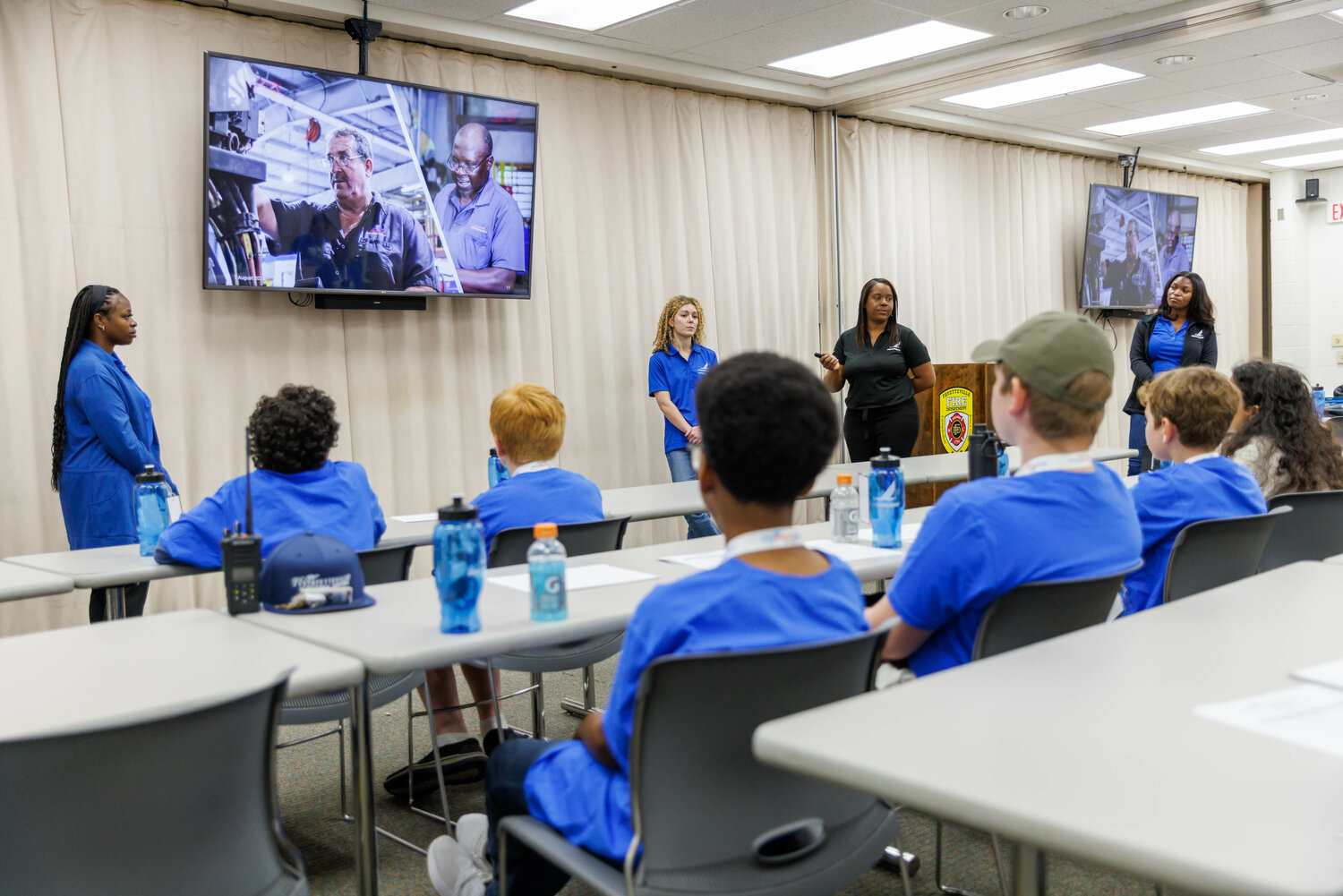The communications team of Piedmont Airlines discuss varying career opportunities within the aviation industry during the Aviation Career Education (ACE) Academy hosted by the Fayetteville Regional Airport on Aug 7, 2023. Photo: Tony Wooten