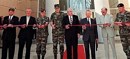Fritz Healy, second from left; retired Lt. Gen. Dan K. McNeill; retired Gen. Hugh Shelton; retired Gen. James J. Lindsay; Ross Perot; and Lt. Gen. William P. Tangney, far right, cut the ribbon on Aug. 16, 2000, at the Airborne & Special Operations Museum.