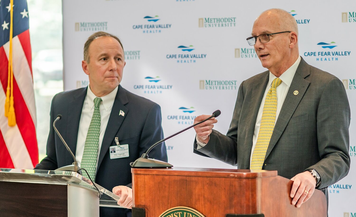 Cape Fear Valley Health CEO Michael Nagowski, left, and Methodist University President Stanley T. Wearden speak during February's announcement of a proposed medical school.