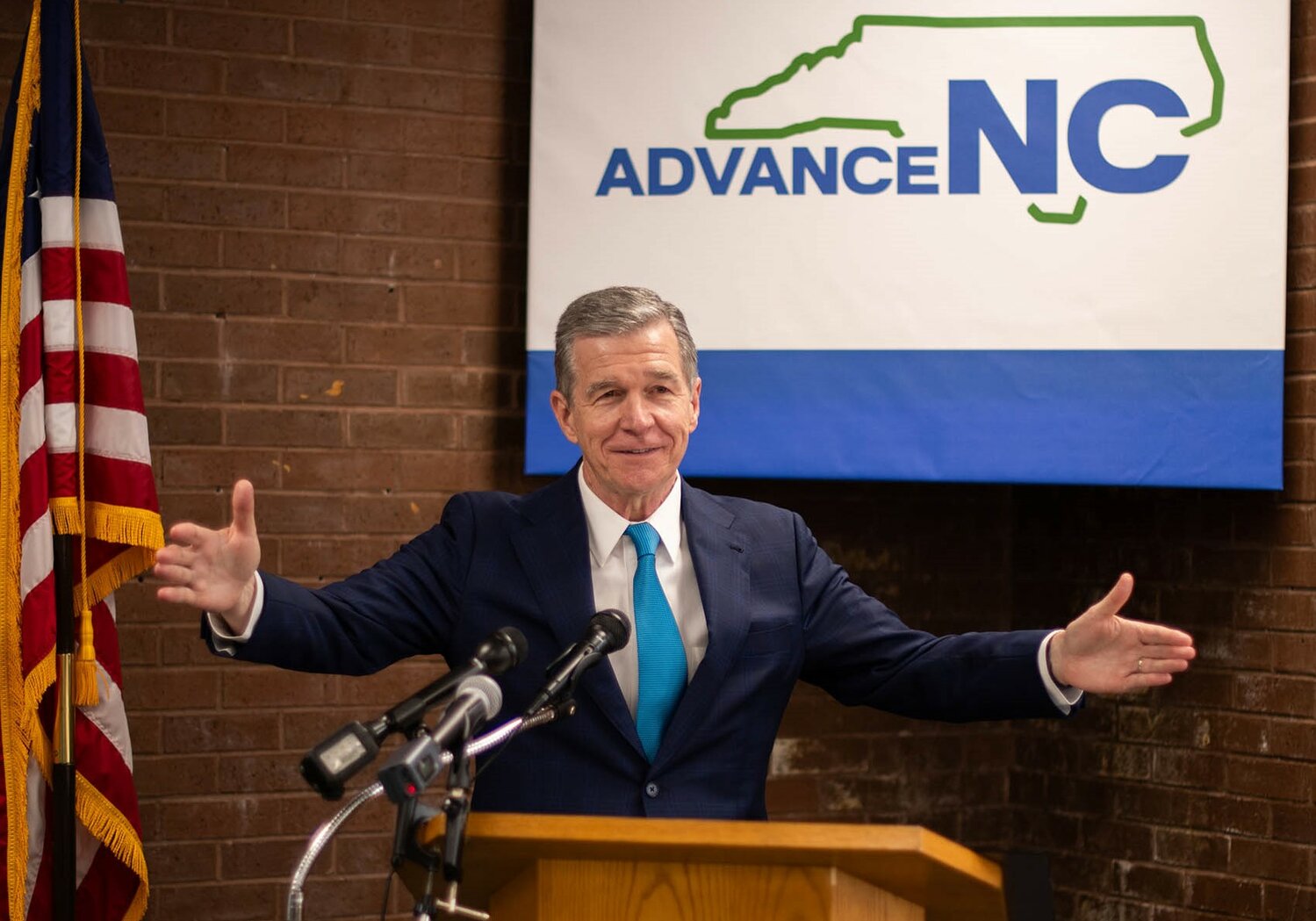 N.C. Gov. Roy Cooper speaks at a meeting of representatives of community colleges, universities and workforce development boards about the AdvanceNC regional workforce development partnership.