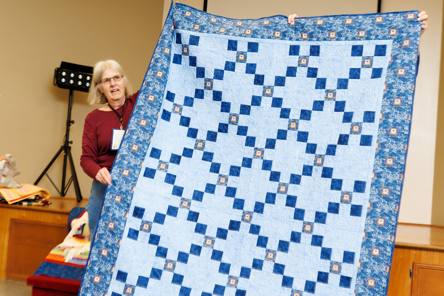 Pam Hathaway displays the quilt she made for her grandson during the monthly Tarheel Quilters Guild on Oct. 15, 2023. Photo: Tony Wooten