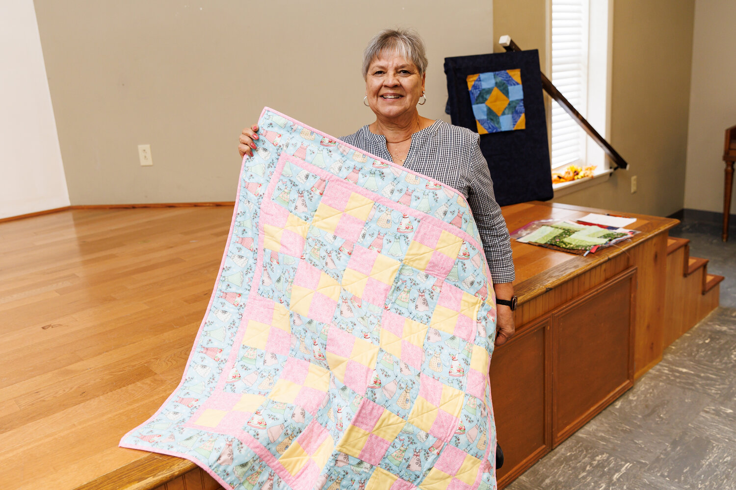 Carol Starnes shares a quilt she made as a donation to the NICU. Photo: Tony Wooten