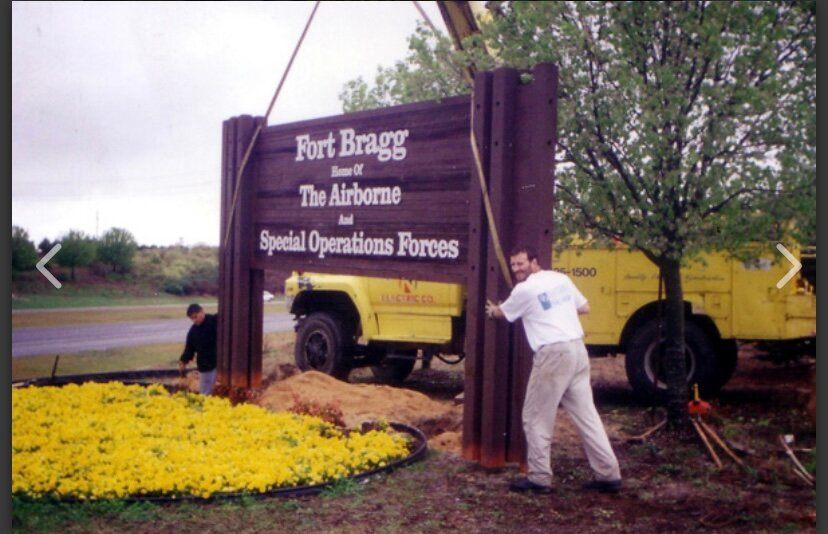Matt Blashfield in a photo taken during an earlier sign installation at Fort Bragg. Blashfield Sign Company has been doing work in and around the base for more than 30 years.