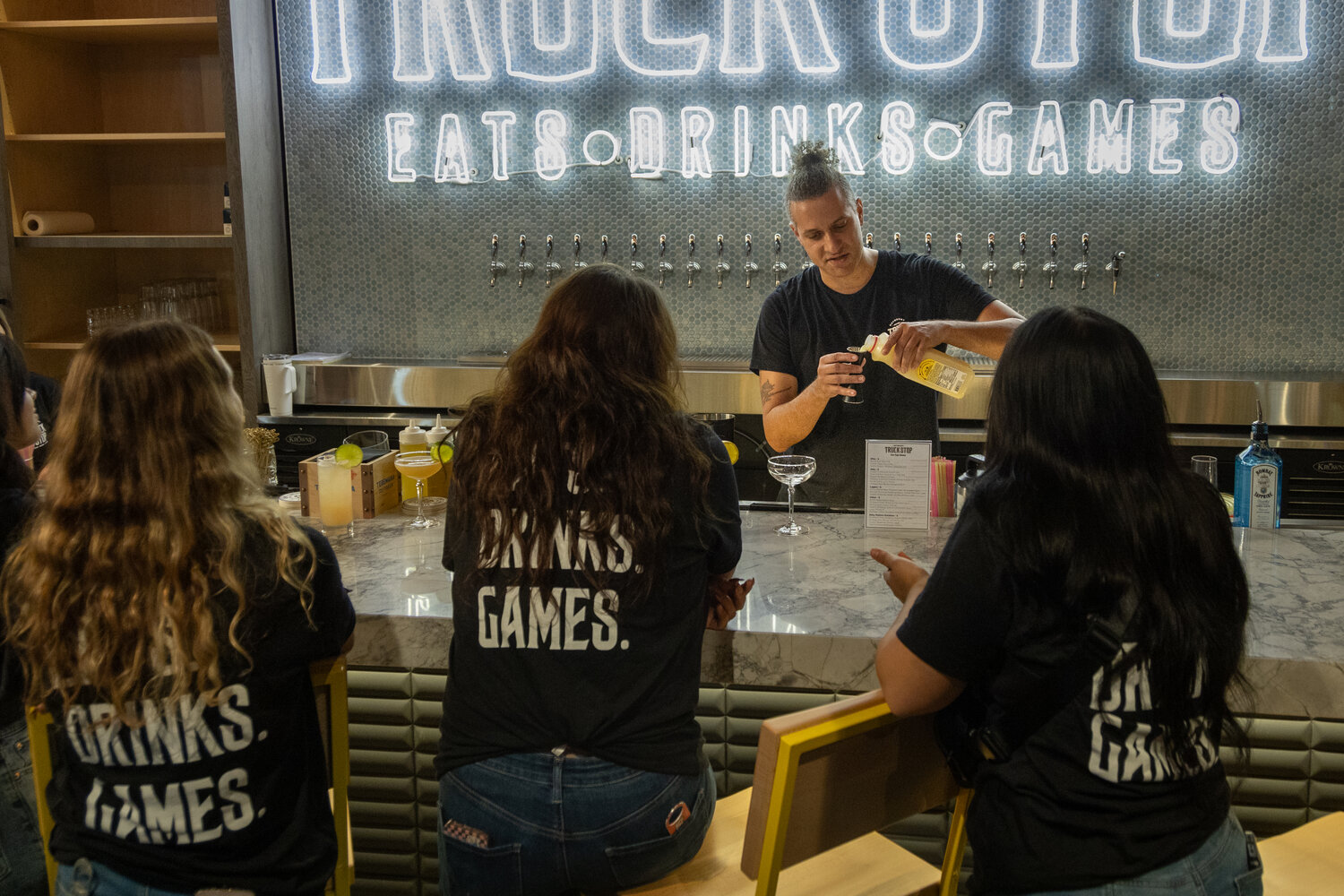 Bar Manager Maurice Spagatner at the new Haymount Truck Stop shows bartenders how to make drinks. This was during the Truck Stop’s soft opening on Wednesday.