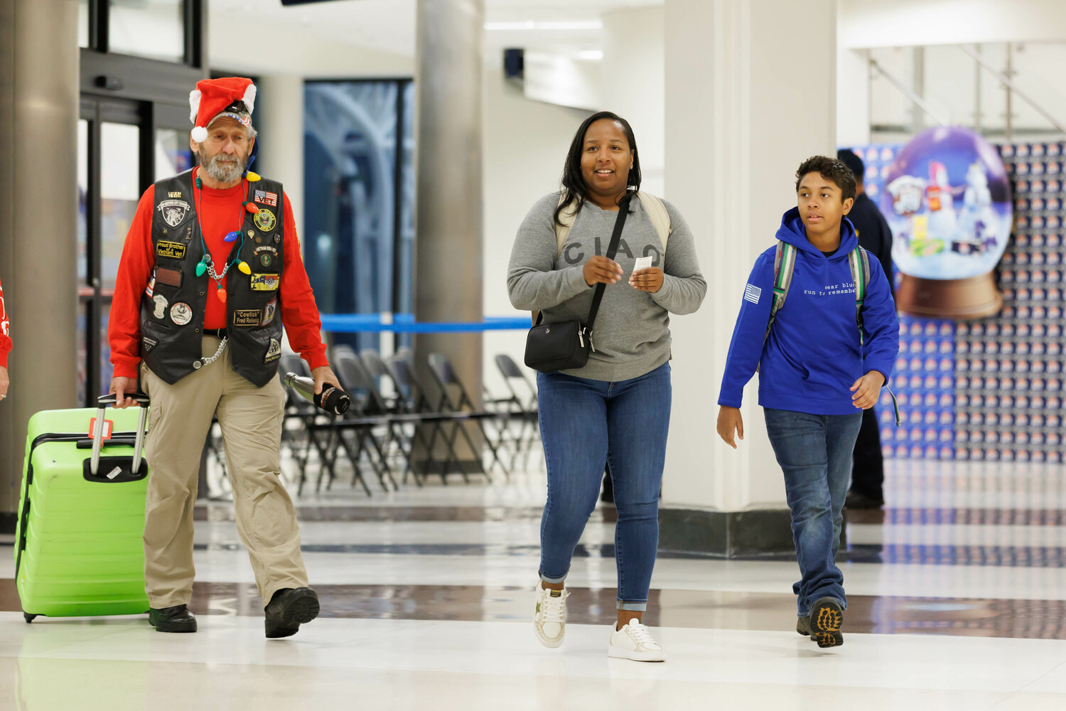 Families of fallen military members gather at Fayetteville Regional Airport for a trip to Disney World on board the Gary Sinise Foundation Snowball Express's American Airlines charter on Dec. 2, 2023.
