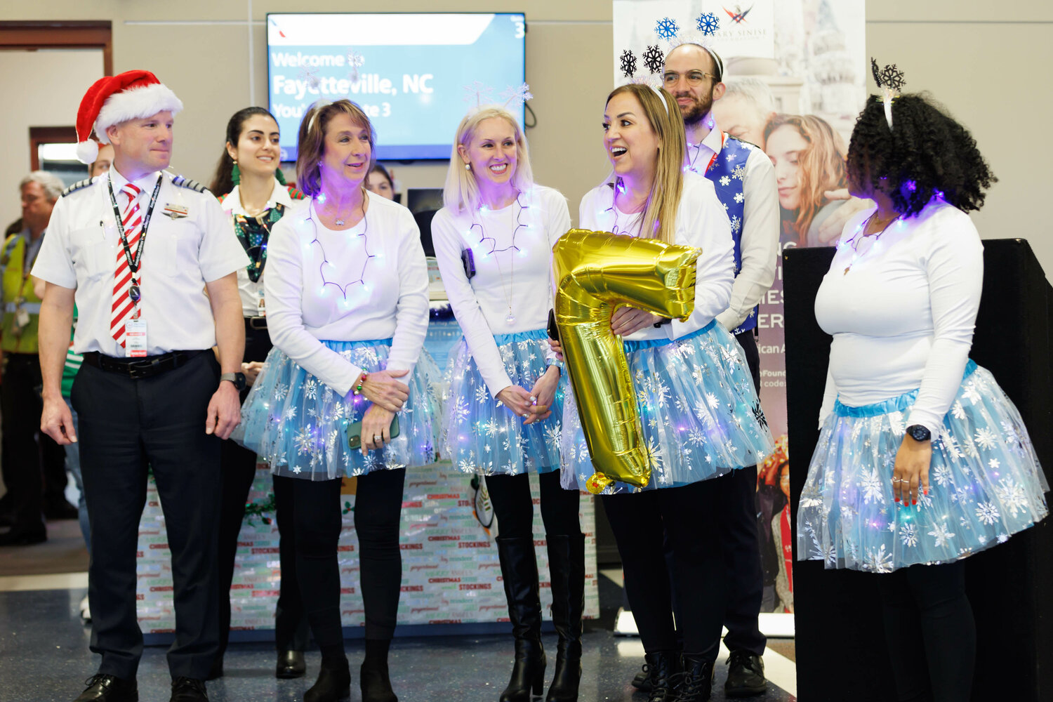 The American Airlines crew greets the Gold Star families preparing to board the Snowball Express on Dec. 2, 2023.