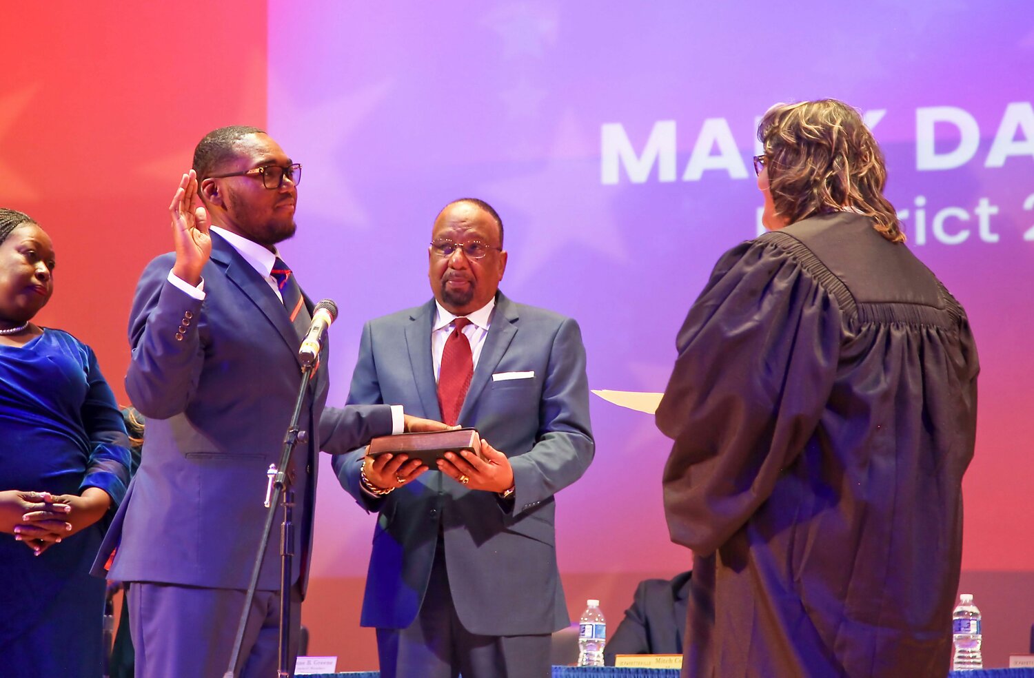 Councilman Malik Davis takes the oath of office at the Fayetteville City Council inauguration ceremony on Dec. 6, 2023. Davis, 28, will represent District 2 on the council.