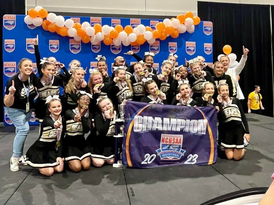 Gray’s Creek junior varsity team celebrates a cheerleading championship in the non-tumbling competition.