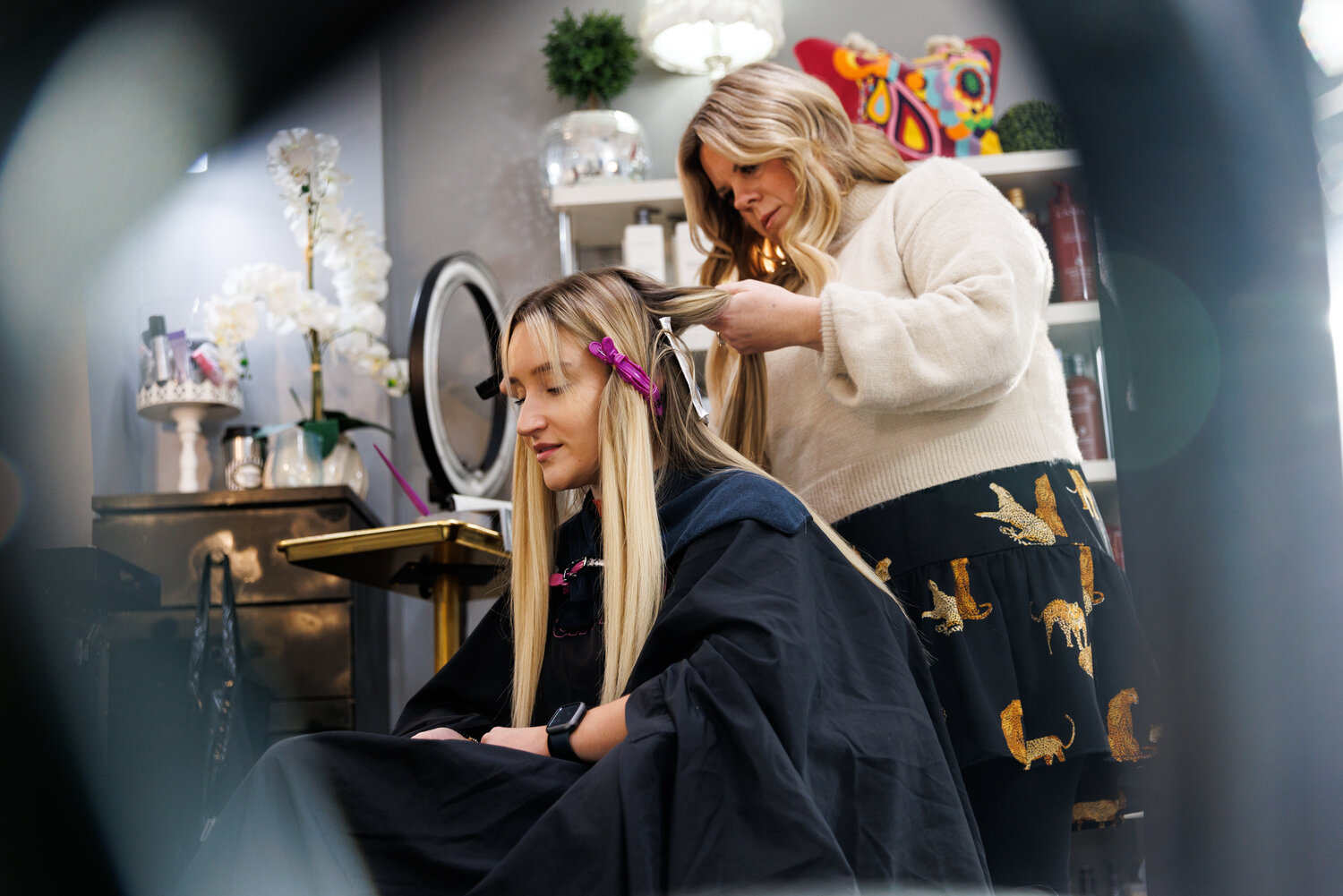 Madison Miller, a pre-med college student at Fayetteville Technical Community College, visits Bombshells Salon quarterly. She enjoys relaxing and talking with the owner, Suzanne Williams, as she styles her hair.
