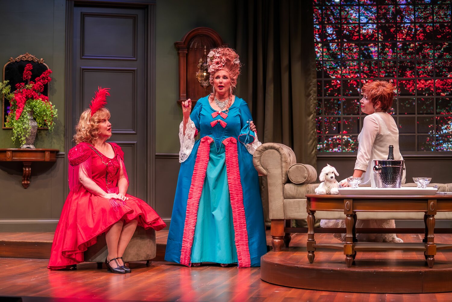 Morgan Fairchild (center) dons a wig and costume in the role of Monette Gentry alongside co-stars Lori Legacy (left) and Cathy Barnett (right) during the dress rehearsal for “Always a Bridesmaid,” a comedy produced last November at the New Theatre and Restaurant in Overland Park, Kansas.