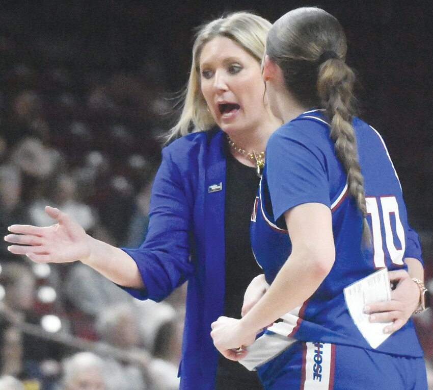 Alaura Sharp coaches during the First Four game at the Colonial Life Arena