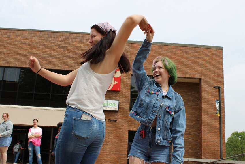 CUTLINE:  Lander University students Patience Ninneman, a sophomore visual arts major from Spartanburg, left, and Riley Yearout, a sophomore history major from Simpsonville, show off their denim during the Denim Day fashion show on April 17.  Photo by Lindsey Hodges.