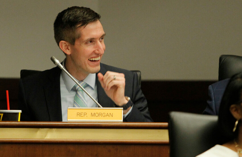 Rep. Adam Morgan shares a laugh with other members before the start of the Education and Public Works Full Committee meeting in Columbia, S.C. on Tuesday, March 1, 2022. (Travis Bell/STATEHOUSE CAROLINA)