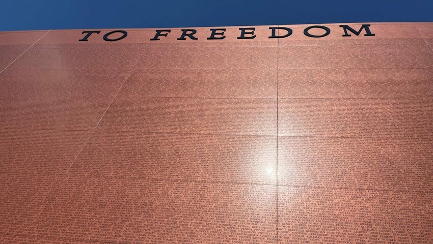 The sun is reflected in the National Monument to Freedom in Montgomery, Alabama on June 26, 2024. The monument is inscribed with the names of 122,000 families listed in the 1870 census, the first in which many former enslaved people were recorded. (Brian Lyman/Alabama Reflector)