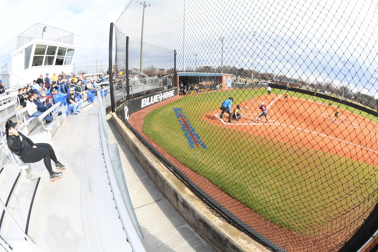The PC Softball Complex has new spectators' seating, a press box, and lights after extensive renovations. A restrooms building is nearby.