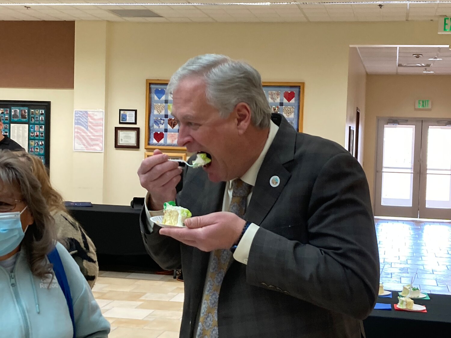 Sandoval County Manager Wayne Johnson enjoys a slice of cake at last week's Founder's Day celebration.