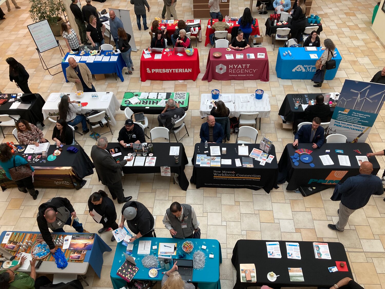 Job seekers browsed tables staffed by representatives of several local businesses during the job fair held in conjunction with Sandoval County's Founders Day celebration.