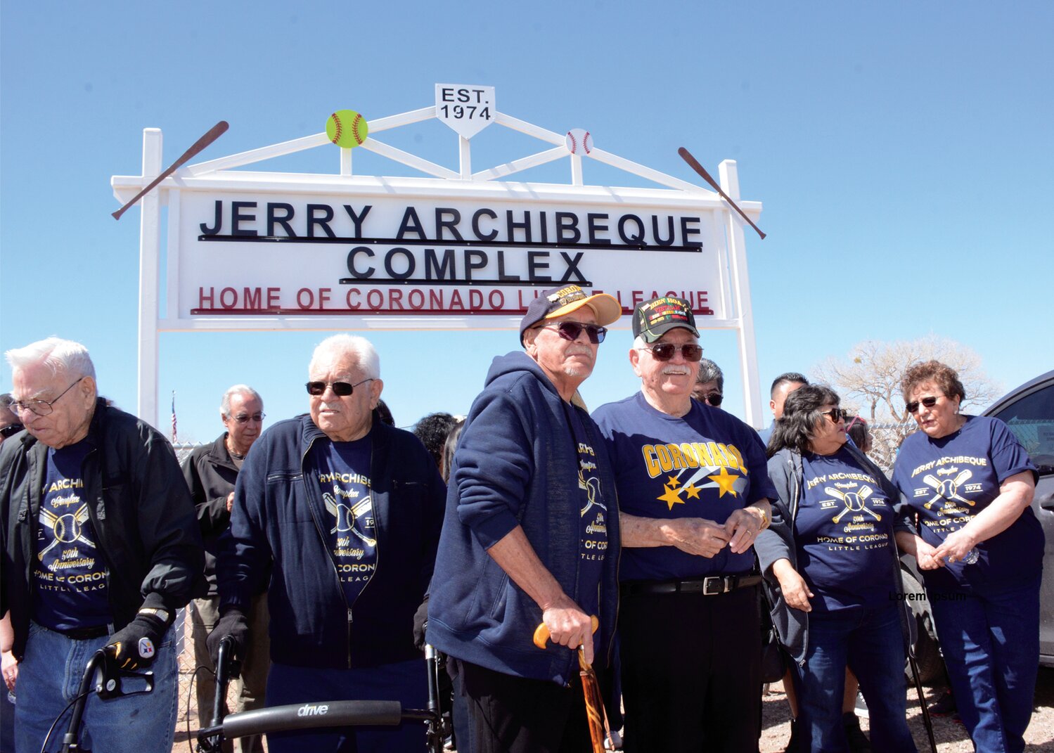 Family, friends and fans of Jerry Archibeque gather outside the new entrance sign to the town of Bernalillo baseball fields, home to the Little League program he founded 50 years ago. From left are his brothers Jake and Clemente Archibeque, Jose B. Trujillo, who helped build the first field, Jerry Archibeque, sister Gloria Archibeque-Lovato, and Lena Archibeque, Jerry's wife. (Bill Diven/Sandoval Signpost)