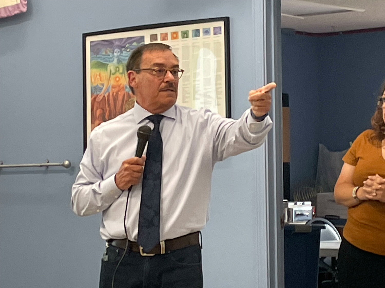 Deputy County Manager John Garcia calls on someone with a question at a May 17 town hall meeting on a proposed ordinance to ban the feeding of wild horses. (T.S. Last/Sandoval Signpost)