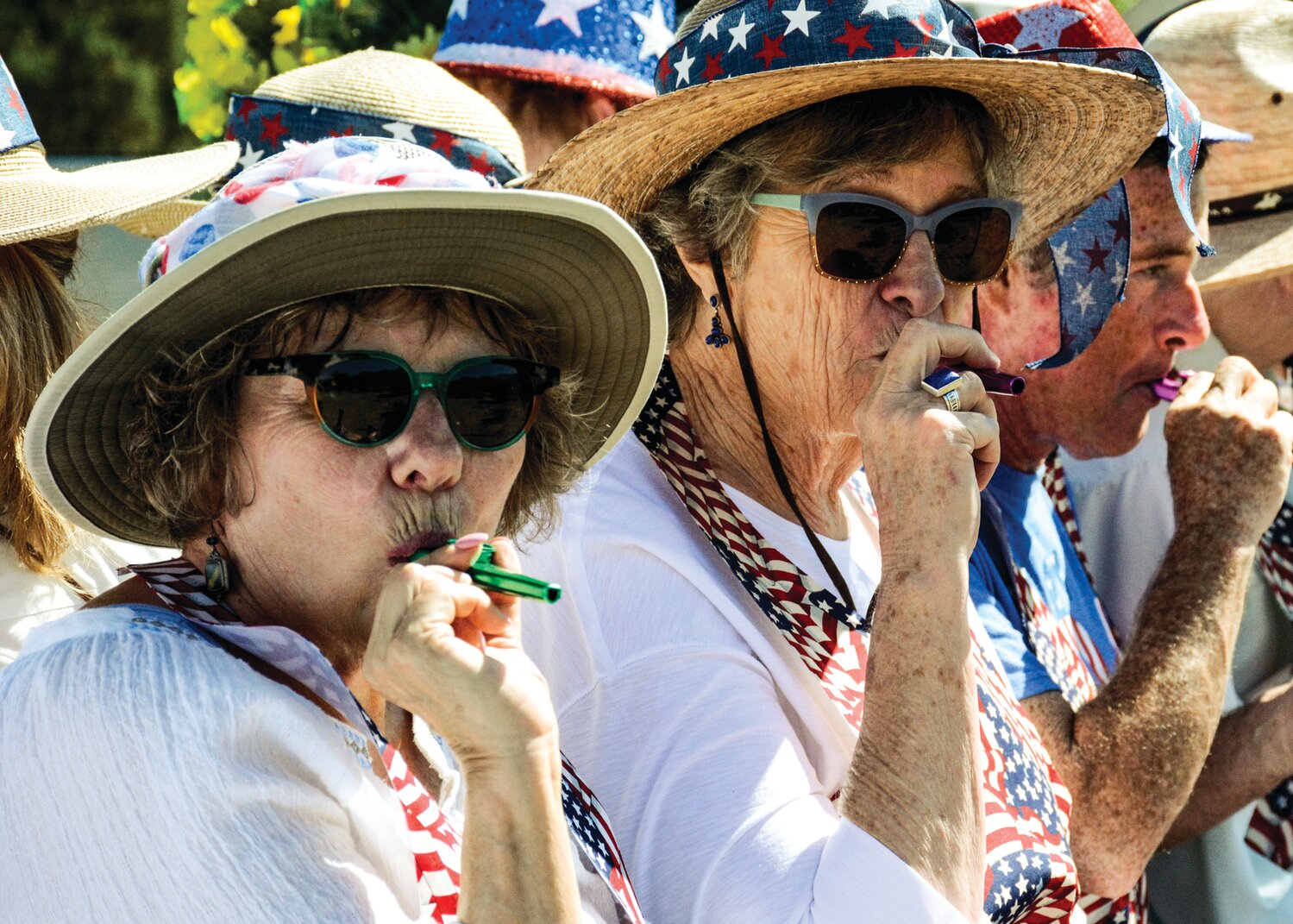 Claudia and Robert Moraga of Placitas came early and staked out a shady spot to watch the Fourth of July parade.