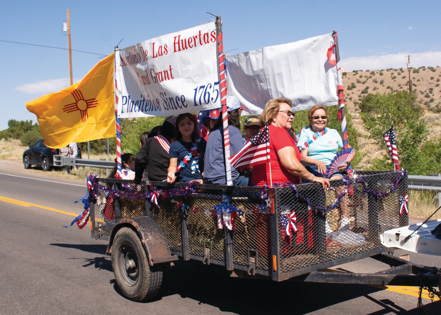 Processions in Placitas village are nothing new for the early settlers and now their heirs who keep alive the San Antonio de las Huertas Land Grant founded, as their banner shows, in 1765.