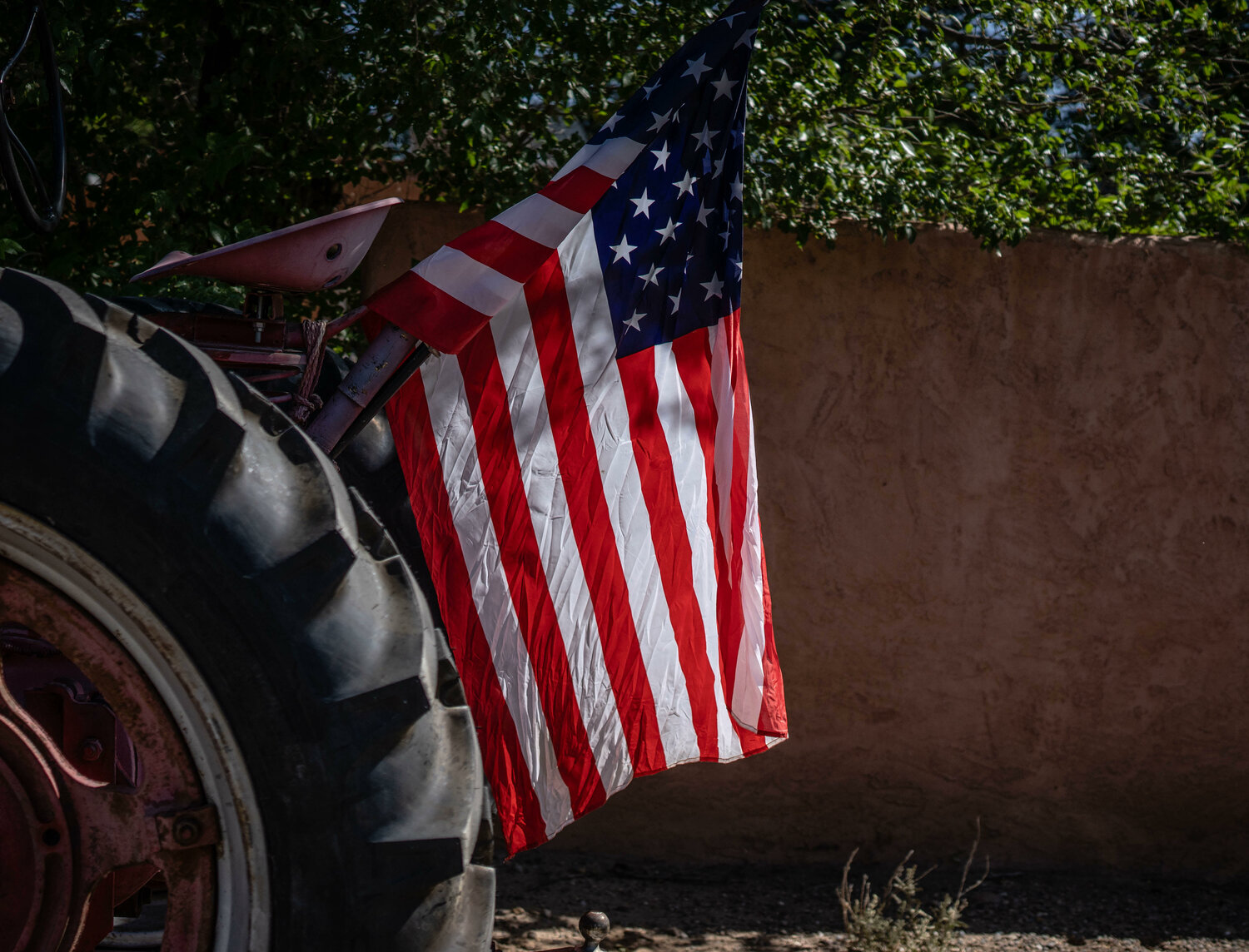 Dozens of tractors from the Corrales Tractor Club await to participate in the village's Fourth of July parade. (Roberto E. Rosales/Corrales Comment)