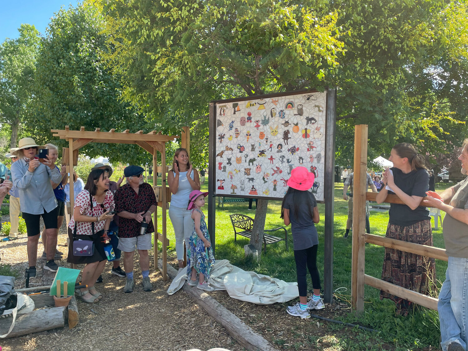 A mural created my dozens of community members was unveiled at the Children's Garden at the Corrales Community Library on July 8. (T.S. Last/Corrales Comment)