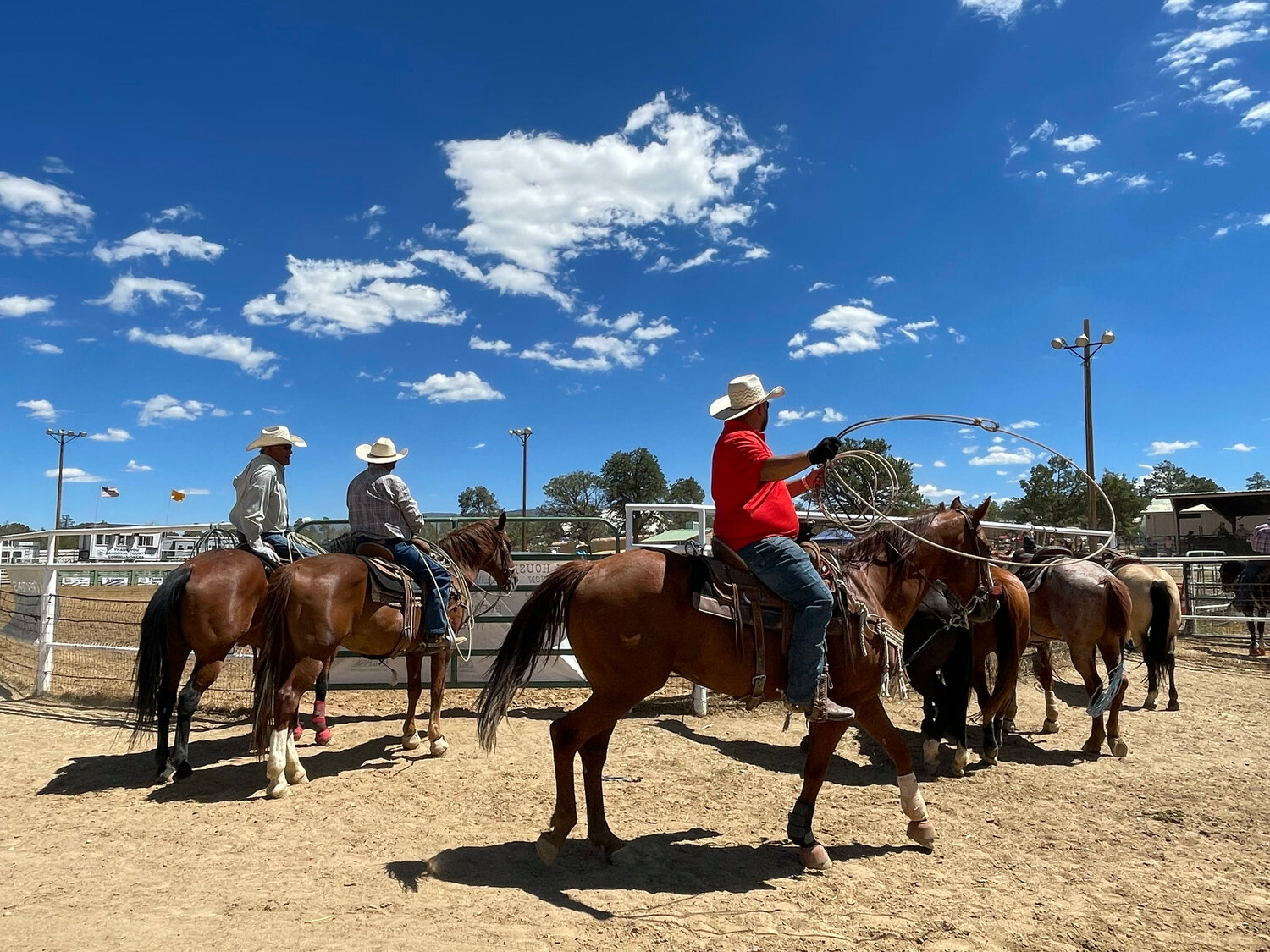 Cowboys await their turn during the roping contests at the Sandoval County Fair on Aug. 5.