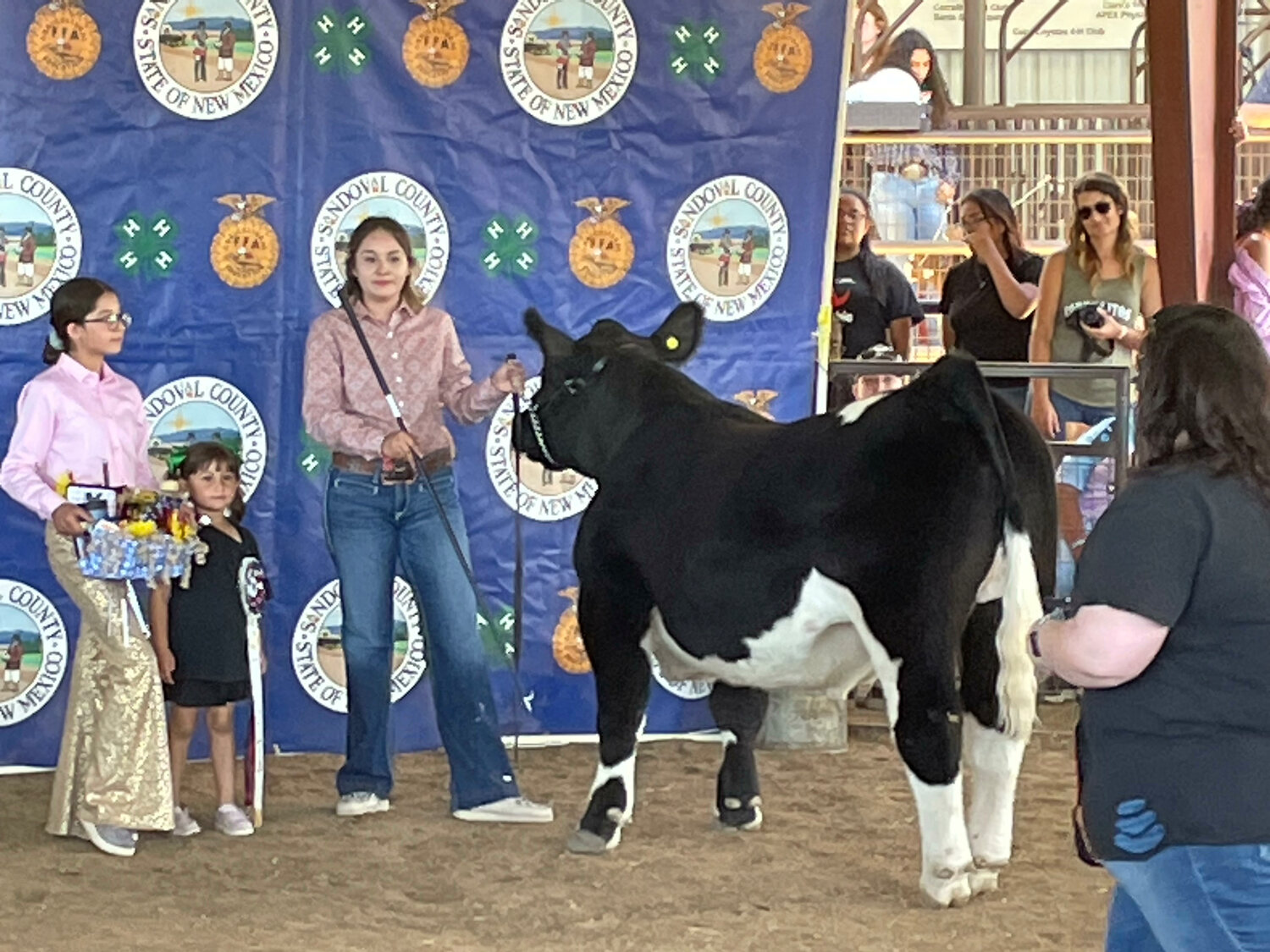 Lisette Sanchez, of the Cuba Coyotes 4-H Club, displays her grand champion steer, which sold for $6,000 at this year's Sandoval County Fair.