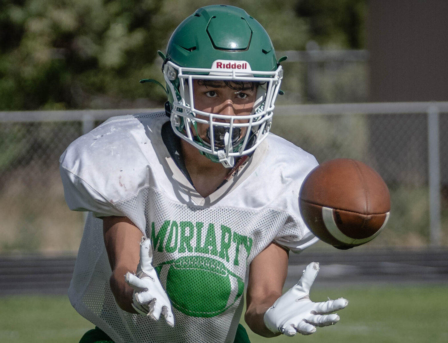 Moriarty’s Isaiah Quintana catching a pass during practice.