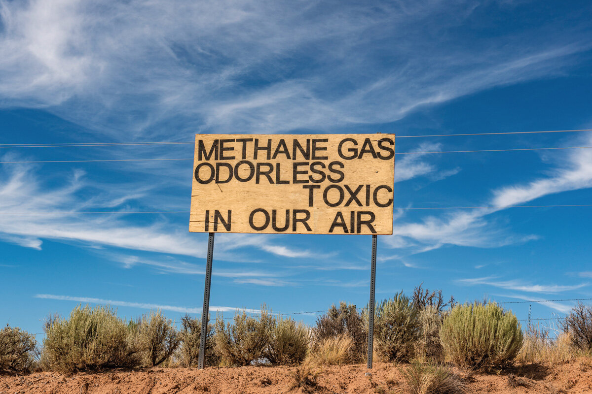 A sign along Highway 550, east of the Navajo Nation in New Mexico, near Lybrook Elementary School, alerts people to the presence of methane from the extensive network of fracking installations in the area.
