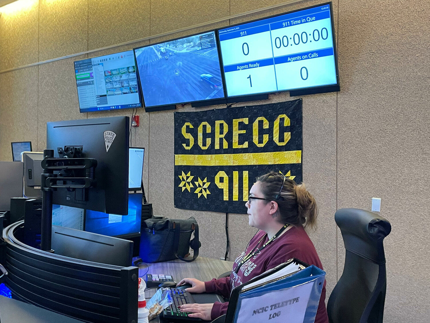 Dispatcher Natasha Gonzales takes calls at the Sandoval County Regional Emergency Communications Center. (T.S. Last/Sandoval Signpost)